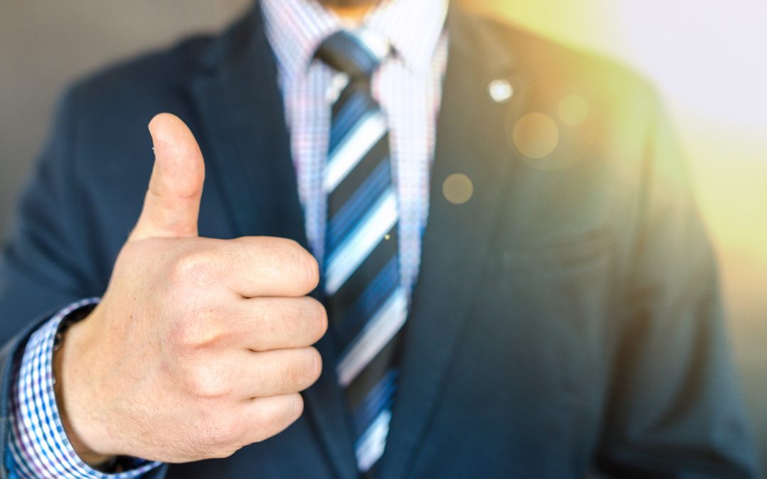 Man in suit, thumbs up, he knows that biblical businesses build better families